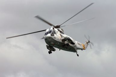 A US Navy (USN) SH-3 Sea King helicopter assigned to Helicopter Combat Support Squadron (HC-85), in flight at Navy Base (NB) Pearl Harbor, Hawaii (HI) for the start of the Rim of the Pacific (RIMPAC) 2006 Exercises. RIMPAC is the largest biennial maritime exercise, which brings together military forces from Australia, Canada, Chile, Peru, Japan, the Republic of Korea, the United Kingdom and the US