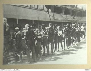 PORT MORESBY, NEW GUINEA. 1942-04-12. EVACUEES FROM NEW BRITAIN, COMPRISING SERVICE PERSONNEL AND CIVILIANS WHO HAD BEEN EVACUATED FROM PALMALMAL ON THE SOUTH COAST OF NEW BRITAIN BY HMAS ..