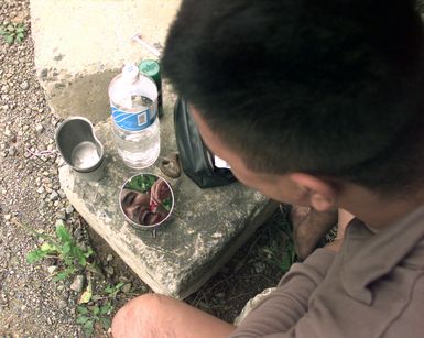 CPL Joe Federico from the 2d Battalion, 8th Marines, out of Camp Lejeune, N.C., brushes his teeth at Marine Expeditionary Camp-Pohang (MEC-P), Oct. 11, 1998. Federico, originally from Honolulu, Hawaii, is a baker deployed to MEC-P in support of Foal Eagle '98