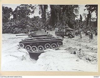 TOROKINA AREA, BOUGAINVILLE, 1945-08-08. AN M24 GENERAL CHAFFEE LIGHT TANK NEGOTIATING A SIX FOOT DITCH DURING TRIALS CONDUCTED FOR THE WAR OFFICE