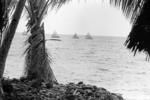 Canoe fleet on the lagoon. The outer islets can be seen in the background