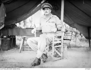 ALEXISHAFEN NORTH, NEW BRIGADIER M.A. FERGUSSON, DSO, MC, ED, COMMANDING OFFICER, 8TH INFANTRY BRIGADE SEATED OUTSIDE HIS TENT