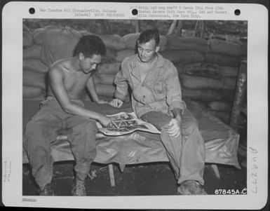 Liberated Chinese Boy Is Taught To Speak English At Bougainville, Solomon Islands. Too-Far-Pin, Known As Chu To The Gi'S, Was Taken Prisoner During The New Georgia Campaign. Chu Had Been Pressed Into Service By The Japanese And This Was His First Chance T (U.S. Air Force Number 67845AC)