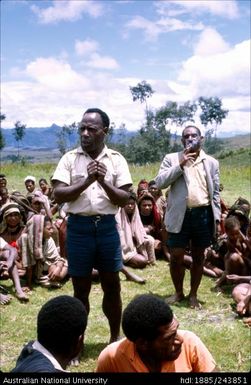 Men wearing uniform addressing a group