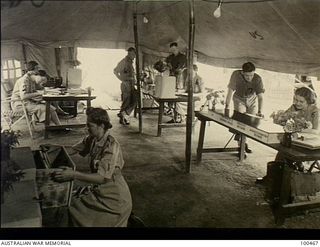 Port Moresby, New Guinea. 1944-05-29. The interior of the Orderly Room, 2/1st Australian General Hospital, where members of the Australian Army Medical Women's Service (AAMWS) and soldiers carry ..