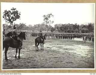 POM POM VALLEY, NEW GUINEA. 1943-11-30. THE COMMANDING OFFICER OF THE 2/12TH AUSTRALIAN INFANTRY BATTALION TAKING THE BATTALION PARADE. IDENTIFIED PERSONNEL ARE: QX6008 LIEUTENANT COLONEL C. C. F. ..