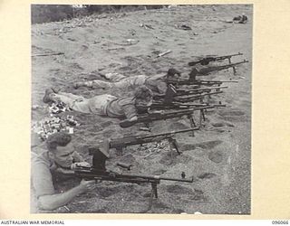 CAPE PUS, WEWAK AREA, NEW GUINEA. 1945-09-07. ARMOURERS OF 110 BRIGADE WORKSHOP, MANNING BREN GUNS AND FIRING TOWARDS THE SEA DURING PERIODICAL INSPECTION AND TESTING OF SMALL ARMS OF 16 INFANTRY ..