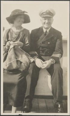 Molly knitting alongside of Captain J.H. Trask, sitting on board the Sonoma, 1915?