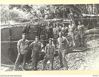 SAIDOR, NEW GUINEA, 1944-02-10. MEMBERS OF COMPANY B, 542ND UNITED STATES BOAT COMPANY, WITH AN INIDENTIFIED AUSTRALIAN SOLDIER AT WHITE BEACH, SAIDOR, NEW GUINEA. IDENTIFIED PERSONNEL ARE: ..