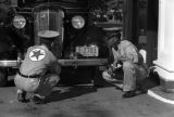 Guam, men servicing a car at a Texaco station