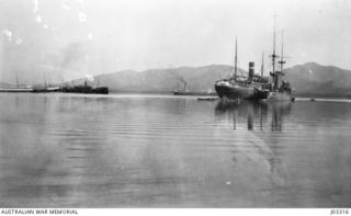 A VIEW OF FAIRFAX HARBOUR, THE ANCHORAGE OF PORT MORESBY, SHOWING SOME SHIPS OF THE EXPEDITION THE DAY BEFORE SAILING FOR SIMPSONHAFEN. (DONATED BY LIEUTENANT COMMANDER G.A. HILL, RNR.)