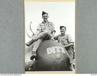 WARDS STRIP, PORT MORESBY, NEW GUINEA, 1943-06. 411684 FLIGHT SERGEANT J.A. DRUMMOND (PILOT) AND SERGEANT R. ALLAN (NAVIGATOR), BOTH OF NORTH SYDNEY, WITH THEIR NO 30 (LR/F) SQUADRON, RAAF, ..