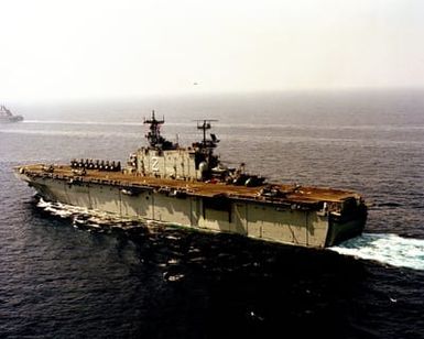 A port view of the amphibious assault ship USS SAIPAN (LHA 2) underway during the NATO Southern Region exercise DRAGON HAMMER '90