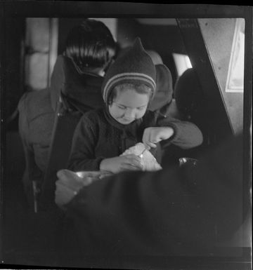 Young child Jennifer Gray, a passenger on Qantas Catalina flying boat service from Suva, Fiji, to Sydney, Australia