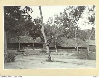 PORT MORESBY, NEW GUINEA, 1944-05-01. THE SIGNAL SECTION AT G BRANCH, HEADQUARTERS NEW GUINEA FORCE. THE SWITCH ROOM IS LOCATED TO THE RIGHT OF THE PICTURE