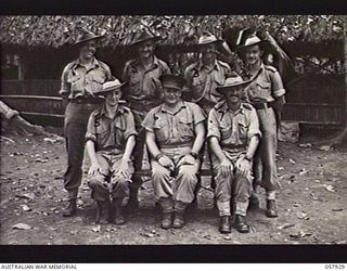 DOBODURA, NEW GUINEA. 1943-10-11. GROUP PORTRAIT OF SENIOR NCOS OF THE CASH OFFICE AND THE ELECTRICAL AND MECHANICAL ENGINEERS STAFF OF THE 11TH AUSTRALIAN DIVISION. LEFT TO RIGHT:- BACK ROW: ..