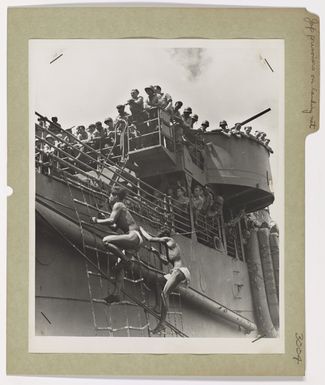 Photograph of Two Japanese Prisoners Climbing the Landing Net Under Observation of Coast Guardsmen