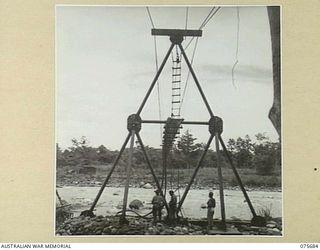 LAE, NEW GUINEA. 1944-09-08. A SECTION OF THE NEW SUSPENSION BRIDGE BEING BUILT OVER THE BUSU RIVER BY MEMBERS OF THE 20TH FIELD COMPANY