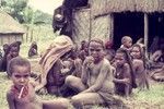 Women and children await the local preacher