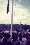 Crowd at Erave patrol post watch while Australian flag is lowered, to be replaced by the newly issued Papua New Guinea flag