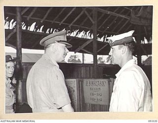LAE AREA, NEW GUINEA, 1945-06-28. HIS ROYAL HIGHNESS, THE DUKE OF GLOUCESTER, GOVERNOR-GENERAL OF AUSTRALIA (1) SPEAKING TO LEADING STOKER J. BAWLCH (2) DURING A VISIT TO LIBRARY AT 2/7 GENERAL ..