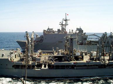 The Military Sealift Command (MSC) underway replenishment oiler USNS WALTER S. DIEHL (T-AO 193) (front) refuels the amphibious assault ship USS GUAM (LPH 9) (perspective) and the dock landing ship USS ASHLAND (LSD 48) (back) during an underway replenishment before the GUAM's Amphibious Ready Group enter the Persian Gulf. GUAM, DIEHL and ASHLAND are deployed to the Persian Gulf in support of Operation Southern Watch