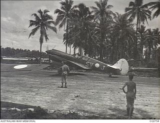 LOS NEGROS ISLAND, ADMIRALTY ISLANDS. 1944-03-08. A RAAF KITTYHAWK AIRCRAFT TAXIS OUT BEFORE TAKING OFF FROM MOMOTE AIRSTRIP TO INTERCEPT A JAPANESE RECONNAISSANCE MACHINE