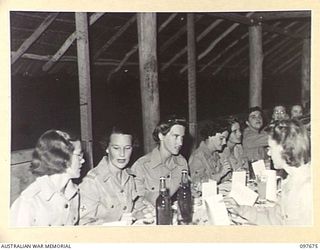 LAE, NEW GUINEA. 1945-10-05. A GENERAL VIEW OF THE FORMAL MESS HELD BY QUEENSLAND AUSTRALIAN ARMY MEDICAL WOMEN'S SERVICE MEMBERS OF 2/7 GENERAL HOSPITAL TO CELEBRATE THE ANNIVERSARY OF THEIR ..