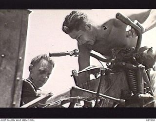 SALAMAUA AREA, NEW GUINEA. 1943-09-20. QX44787 STAFF SERGEANT C. B. BIRD (LEFT) AND QX47883 LANCE CORPORAL M. W. BRADDOCK BOTH OF THE 312TH AUSTRALIAN LIGHT AID DETACHMENT, 29TH AUSTRALIAN INFANTRY ..