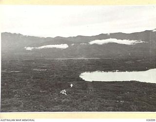 MILNE BAY, PAPUA. 1942-09. GENERAL VIEW LOOKING DOWN OVER COUNTRY AROUND SHORES OF MILNE BAY