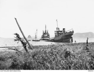 SIMPSON HARBOUR, NEW BRITAIN. 1945-10-25. THE CAMBRIAN SALVOR OPERATED BY THE COMMONWEALTH MARINE SALVAGE BOARD CARRYING OUT ITS SECOND SALVAGE JOB SINCE ARRIVING IN THE HARBOUR. THE BOAT BEING ..