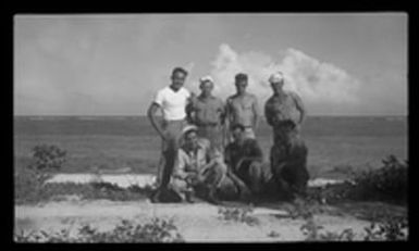 [Servicemen on beach]