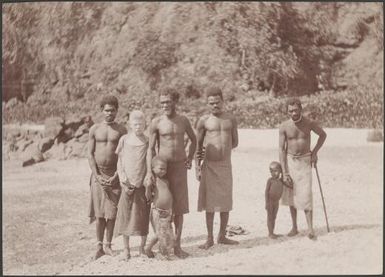 Lakona men and boys, one of whom is albino, on beach at Lakona Bay, Santa Maria, Banks Islands, 1906 / J.W. Beattie