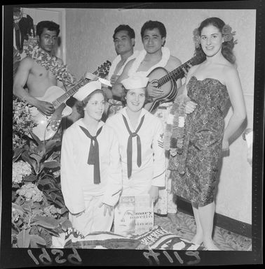 Group in Pacific Island dress and sailor suits at the premiere of the film 'South Pacific', Kings Theatre, Wellington