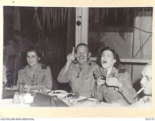 TOROKINA, BOUGAINVILLE. 1945-05-12. PERSONNEL ATTENDING THE OPENING OF THE ARMY OFFICERS CLUB. IDENTIFIED PERSONNEL ARE:- SISTER M.M. STEPHENSON (1); BRIGADIER A.L. DAWKINS, DEPUTY DIRECTOR-GENERAL ..