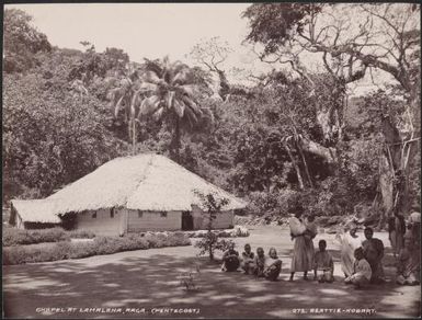 Women and children gathered near the chapel at Lamalana, Raga, New Hebrides, 1906 / J.W. Beattie