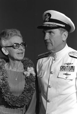 RADM Stanley J. Anderson, commander, Naval Base, Pearl Harbor, stands with Edith Susnir, an honored guest, during a memorial service aboard the USS ARIZONA Memorial commemorating the 40th anniversary of the Japanese attack on Pearl Harbor