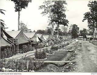 LAE, NEW GUINEA. 1944-09-28. THE WELL KEPT TENT LINES OF NO. 1 PLATOON, 22ND WORKS COMPANY, ROYAL AUSTRALIAN ENGINEERS. THE LINES WERE CONVERTED FROM SWAMPY AREAS BY MEN OF THE PLATOON IN ..