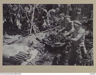 BOUGAINVILLE, 1945-05-16. MORTAR CREWS OF 24 INFANTRY BATTALION FIRING IN SUPPORT OF PATROLS MOVING SOUTH OF THE D COMPANY POSITION ON BUIN ROAD. IDENTIFIED PERSONNEL ARE:- PRIVATE C. SAMPSON (1); ..