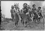 Pig festival, singsing preparations, Tsembaga: led by Muk, Mbabi, and Yemb, decorated men and boys dance