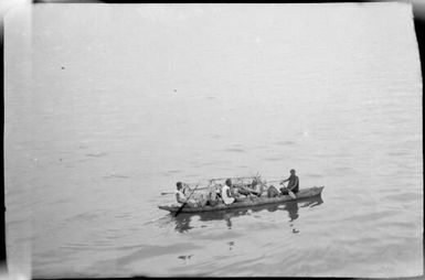 Outrigger canoe laden with produce and three women as crew, Rabaul, New Guinea, ca. 1929, 2 / Sarah Chinnery