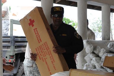 Earthquake ^ Tsunami - Asili, American Samoa, October 7, 2009 -- The American Red Cross, U. S. Army and FEMA were among the many partners establishing a supply distribution center in Asili. The village was one of many in American Samoa impacted by both an earthquake and tsunami last week. David Gonzalez/FEMA