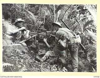 AITAPE, NEW GUINEA. 1945-03-16. A RECEPTION SET NO.4 (AUSTRALIA) ESTABLISHED BY MEMBERS OF HEADQUARTERS 6TH DIVISION SIGNALS TO RECEIVE FIELD REPORTS