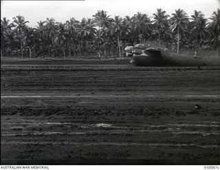 MILNE BAY, PAPUA. C. 1942-10. A BEAUFORT BOMBER AIRCRAFT OF NO. 100 SQUADRON RAAF SENDS UP A SPRAY OF MUD DURING TAKE-OFF FROM GURNEY AIRSTRIP