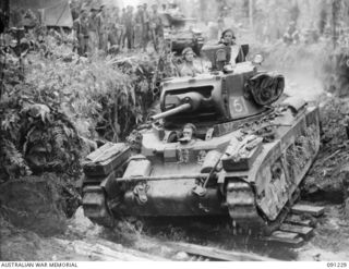 BOUGAINVILLE. 1945-04-26. 2/4 ARMOURED REGIMENT MATILDA TANKS CROSSING THE FORD OVER THE SINDOU RIVER ON THE BUIN ROAD TO SUPPORT THE MOVE FORWARD BY 24 INFANTRY BATTALION TROOPS TO RELIEVE AN ..