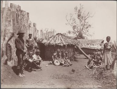 Local people near the inside of the Nore Fou palisade, Solomon Islands, 1906 / J.W. Beattie