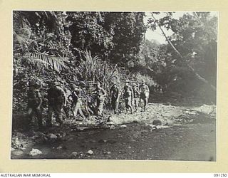 KARAWOP AREA, AITAPE-WEWAK SECTOR, NEW GUINEA. 1945-04-25. MEMBERS OF D COMPANY, 2/1 INFANTRY BATTALION MOVING UP KARAWOP CREEK TOWARDS 1800 FEATURE. OUR TROOPS CLIMBED THE MOUNTAIN UNOPPOSED