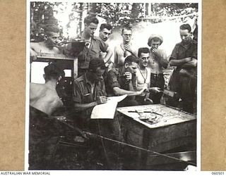 FINSCHHAFEN AREA, NEW GUINEA. 1943-11-13. THE DRAWING OF THE MELBOURNE CUP SWEEP AT 9TH AUSTRALIAN DIVISION HEADQUARTERS