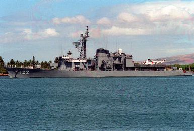 A port beam view of the Japanese Maritime Self-Defense Force (JMSDF) destroyer HATSUYUKI (DD 122) underway as it departs from the naval station after a visit.