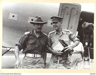 AITAPE, NEW GUINEA. 1944-11-29. MAJOR- GENERAL R H WORDSWORTH, BRITISH ARMY, (2), WITH LIEUTENANT- COLONEL J A BISHOP, GENERAL STAFF OFFICER I HQ 6 DIVISION, (1), ON ARRIVAL AT TADJI AIRSTRIP BY ..